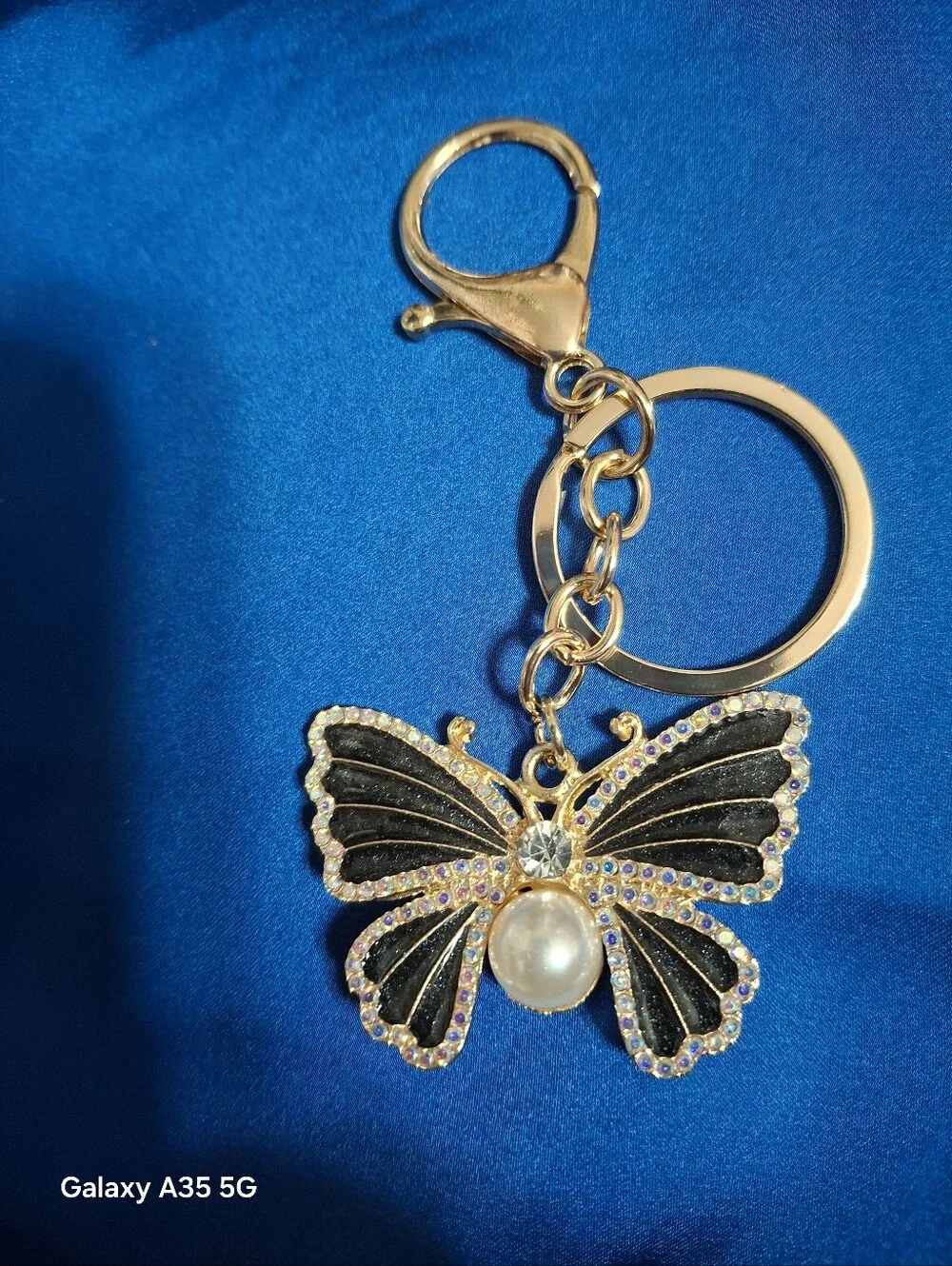 Gold Butterfly Keychain with Black Enamel and Pearl Accent